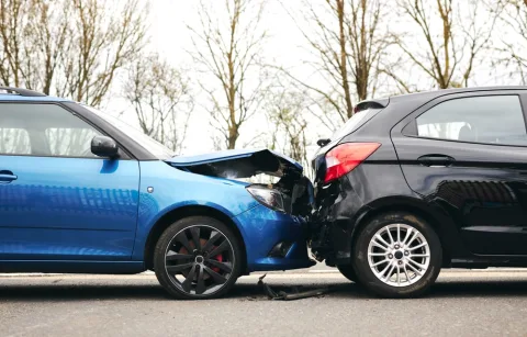 Rear-End car accident involving a blue and black car